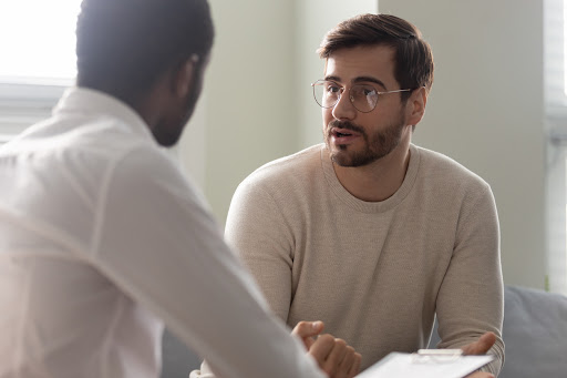 A doctor uses reflective listening when meeting with his patient, who wants to be heard. Seyzo Health